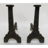 A PAIR OF LARGE 16/17TH CENTURY CAST IRON FIRE DOGS the fronts cast with floral and grape on the