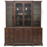 A 19TH CENTURY MAHOGANY BREAKFRONT BOOKCASE with moulded cornice over four beaded glazed doors