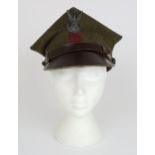 A POLISH ROGATYWKA CAP Of typical square form, the body of khaki wool over a metal-banded brown