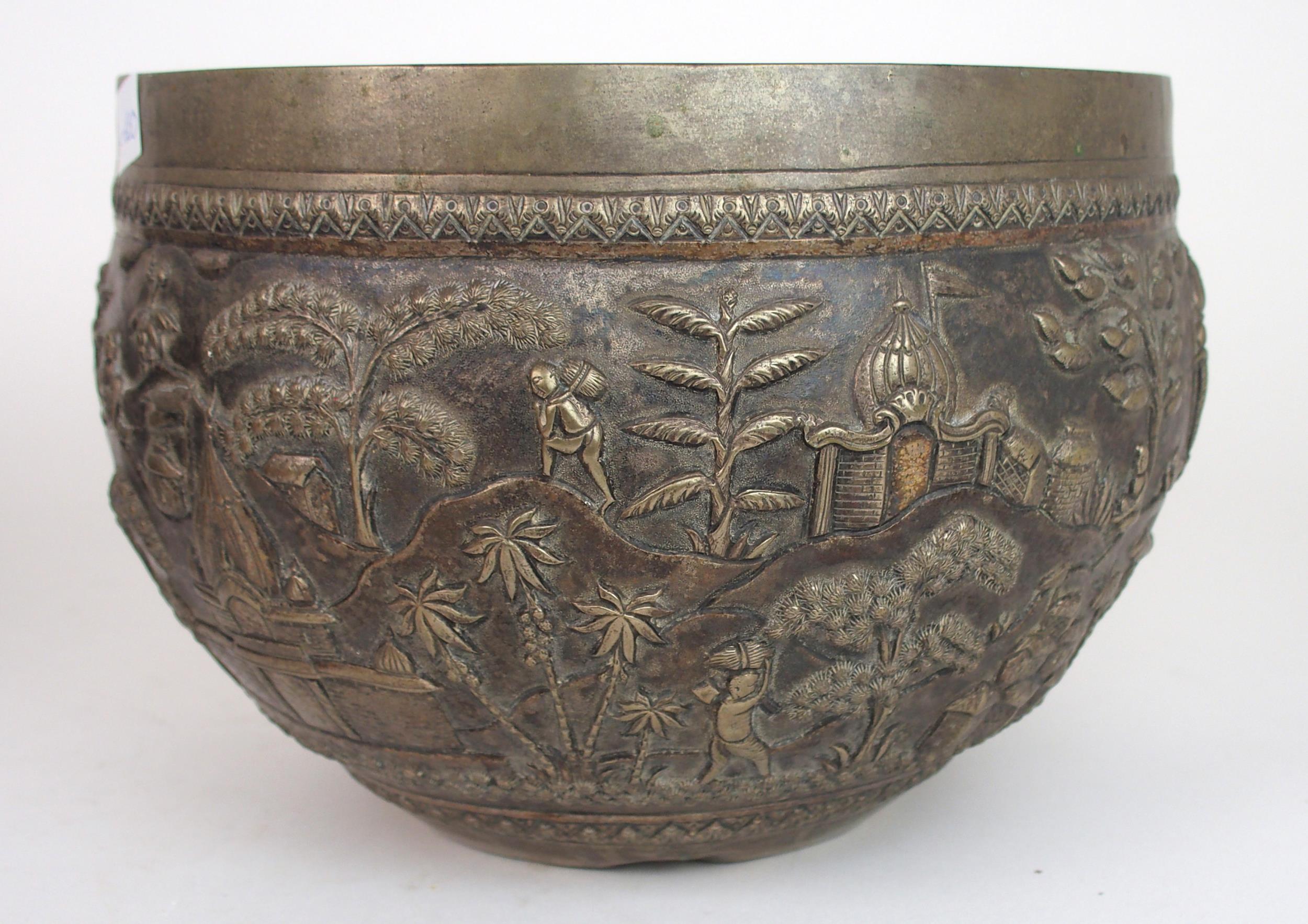 A BURMESE SILVER BOWL of rounded form, with profusely embossed and repousse work of villagers, - Image 12 of 13