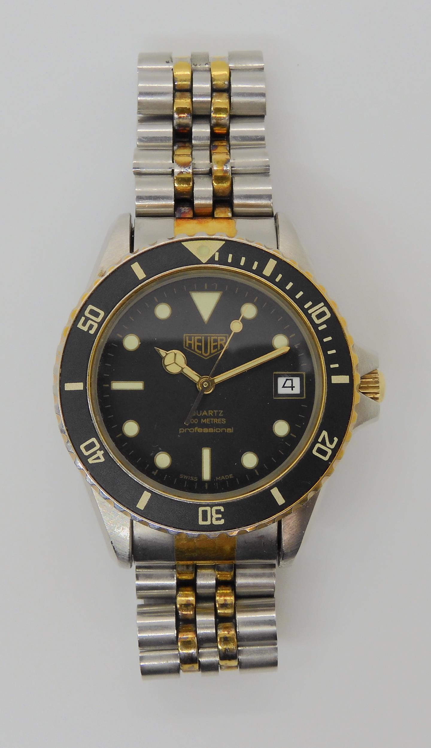 A VINTAGE HEUER WRISTWATCH circa 1983, steel and gold plate diver's watch.  The watch has a black - Image 3 of 11