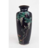 A JAPANESE CLOISONNE BALUSTER VASE  decorated with a bird amongst wisteria branches and above