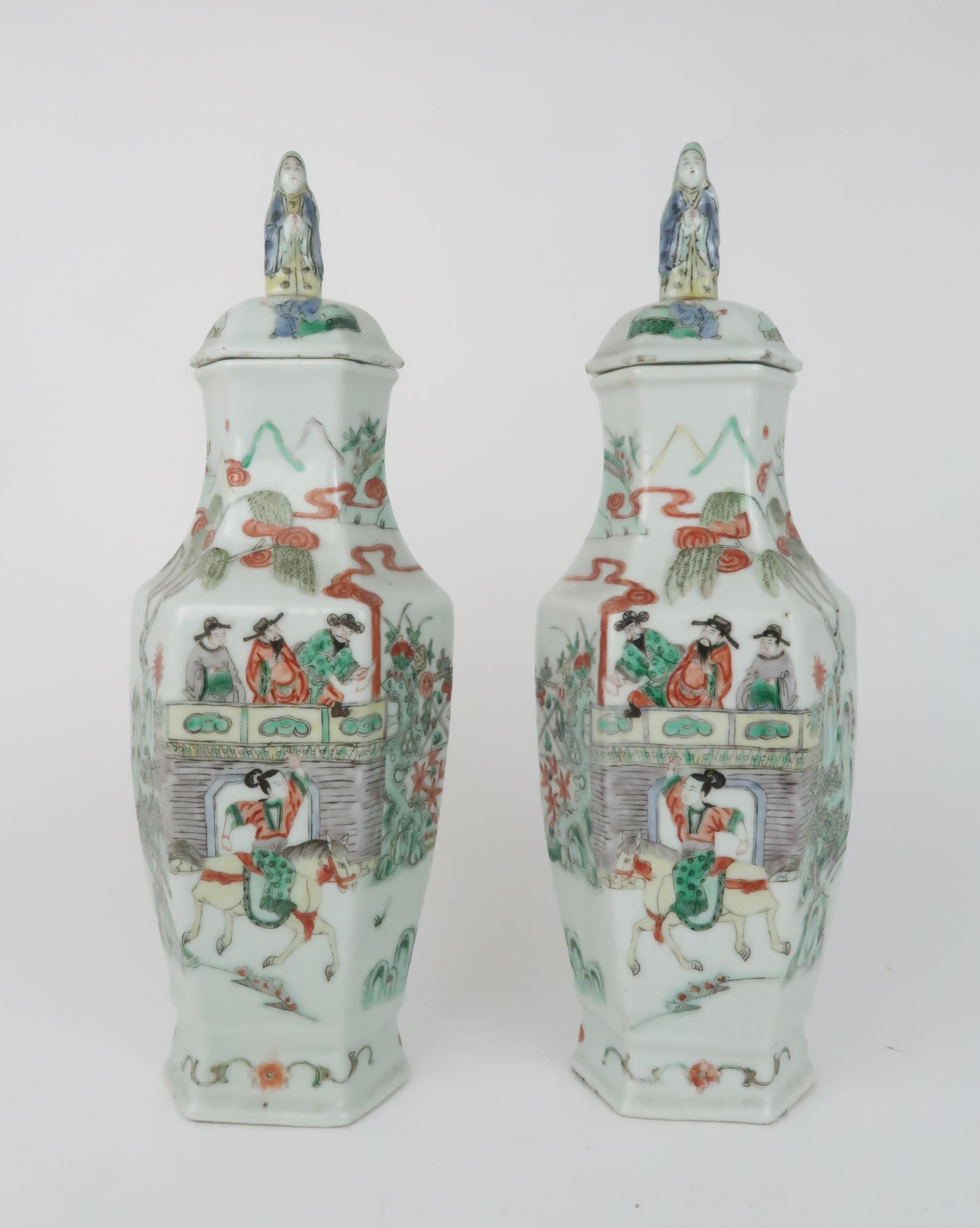 A PAIR OF CANTON HEXAGONAL VASES AND COVERS  painted with horse riders before dignitaries on