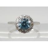 A BLUE ZIRCON AND DIAMOND RING set throughout in platinum, the central blue zircon is approx 6.6mm x