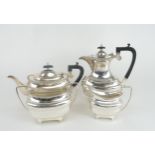 A GEORGE V SILVER FOUR PIECE TEA SERVICE by Walker & Hall, Sheffield 1930, of baluster form, with