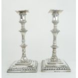 A MATCHED PAIR OF GEORGE III SILVER CANDLESTICKS one with maker's mark IC, London 1770, another