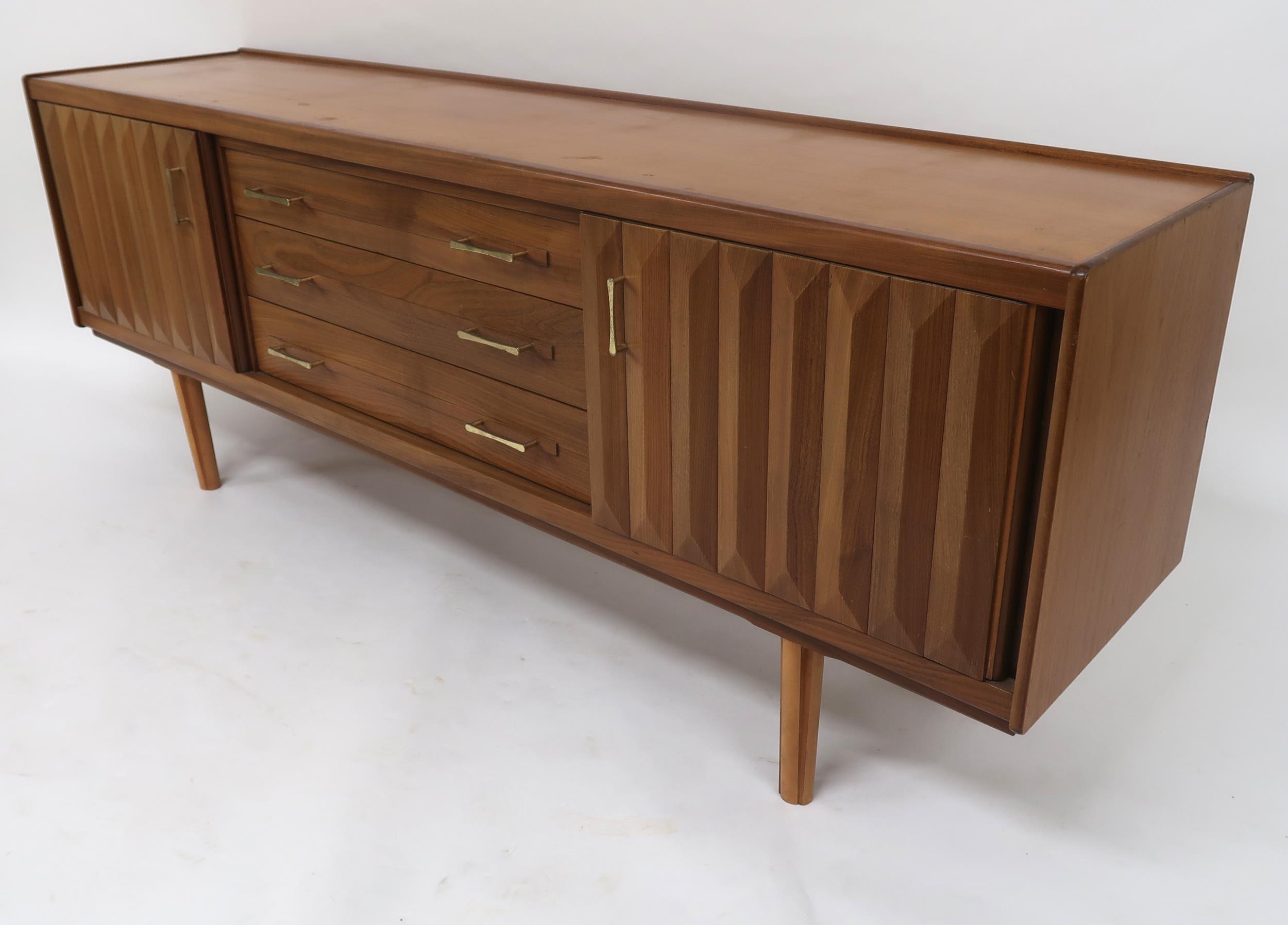 A MID 20TH CENTURY TEAK SIDEBOARD with three long central drawers flanked by cabinet doors with - Image 11 of 12