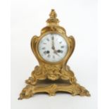 A FRENCH ORMOLU ROCOCO STYLE TIMEPIECE the white dial with roman numerals, the movement stamped with