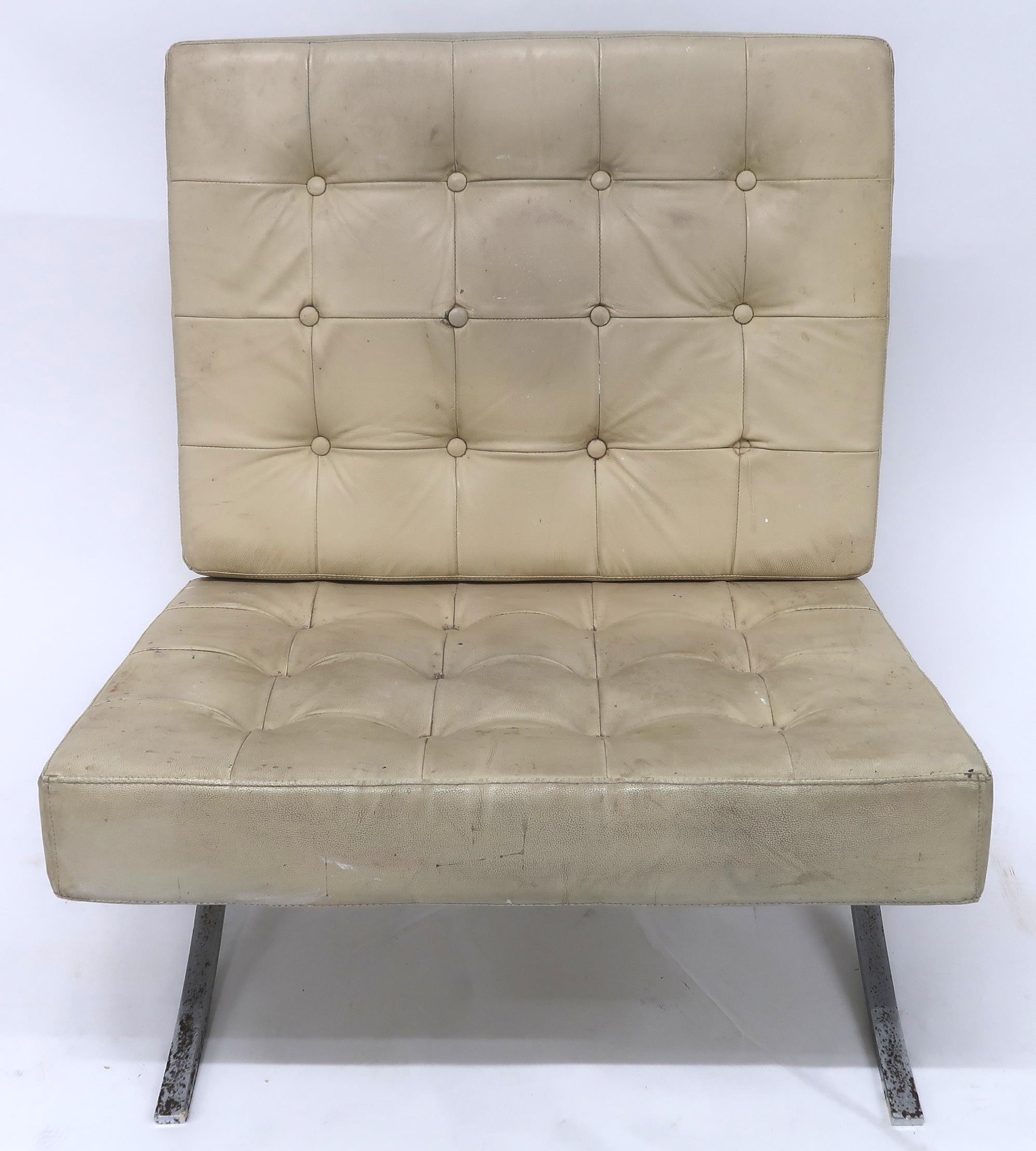 A 20TH CENTURY AFTER LUDWIG MIES VAN DER ROHE "BARCELONA" CHAIR with cream vinyl button back
