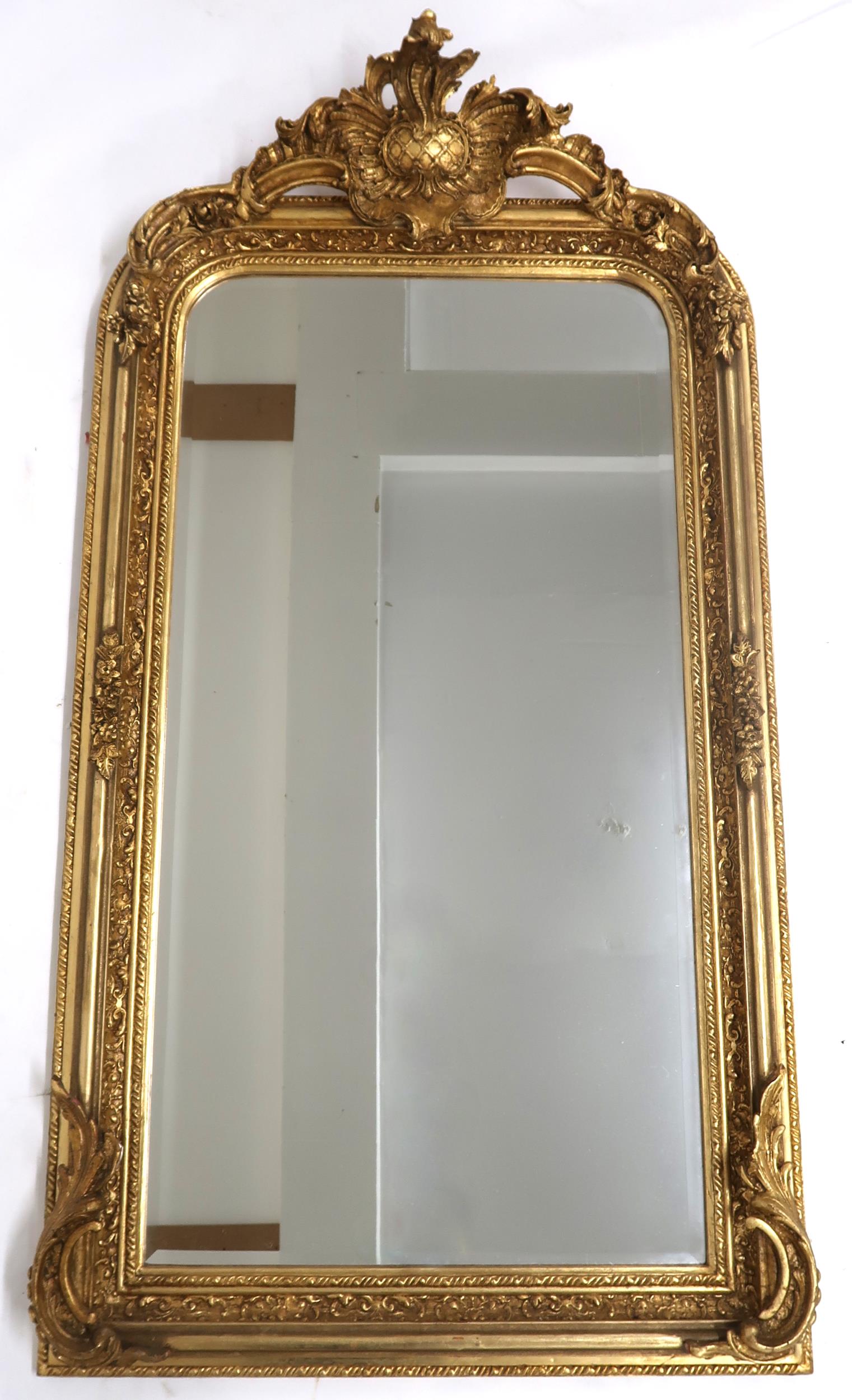 A 20TH CENTURY GILT FRAMED LOUIS PHILIPPE STYLE WALL MIRROR with scrolled foliate and fruit