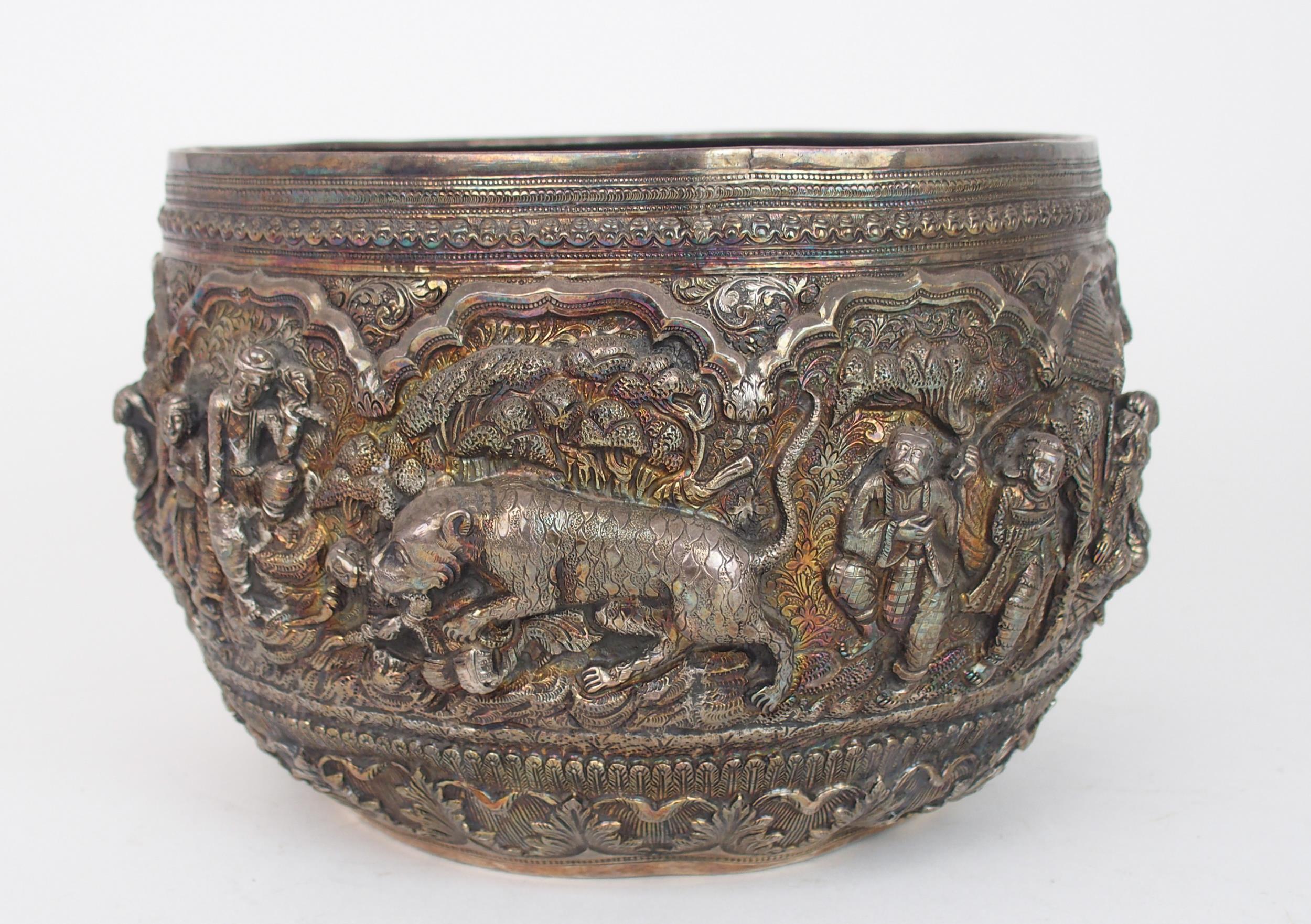 A BURMESE SILVER BOWL of rounded form, with profusely embossed and repousse work of villagers, - Image 3 of 13