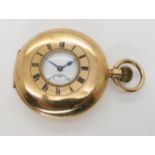 A 9CT GOLD HALF HUNTER POCKET WATCH with enamelled outer chapter ring, white enamelled dial, black