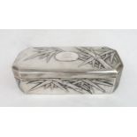 A CHINESE SILVER EXPORT OCTAGONAL BOX  cast with bamboo, surrounding a monogrammed cartouche,