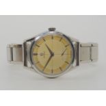 A GENTS VINTAGE OMEGA WRISTWATCH with two tone cross hairs cream dial with silver coloured baton