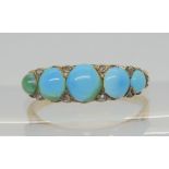 A TURQUOISE AND DIAMOND RING set throughout in bright yellow and white metal, with a scalloped