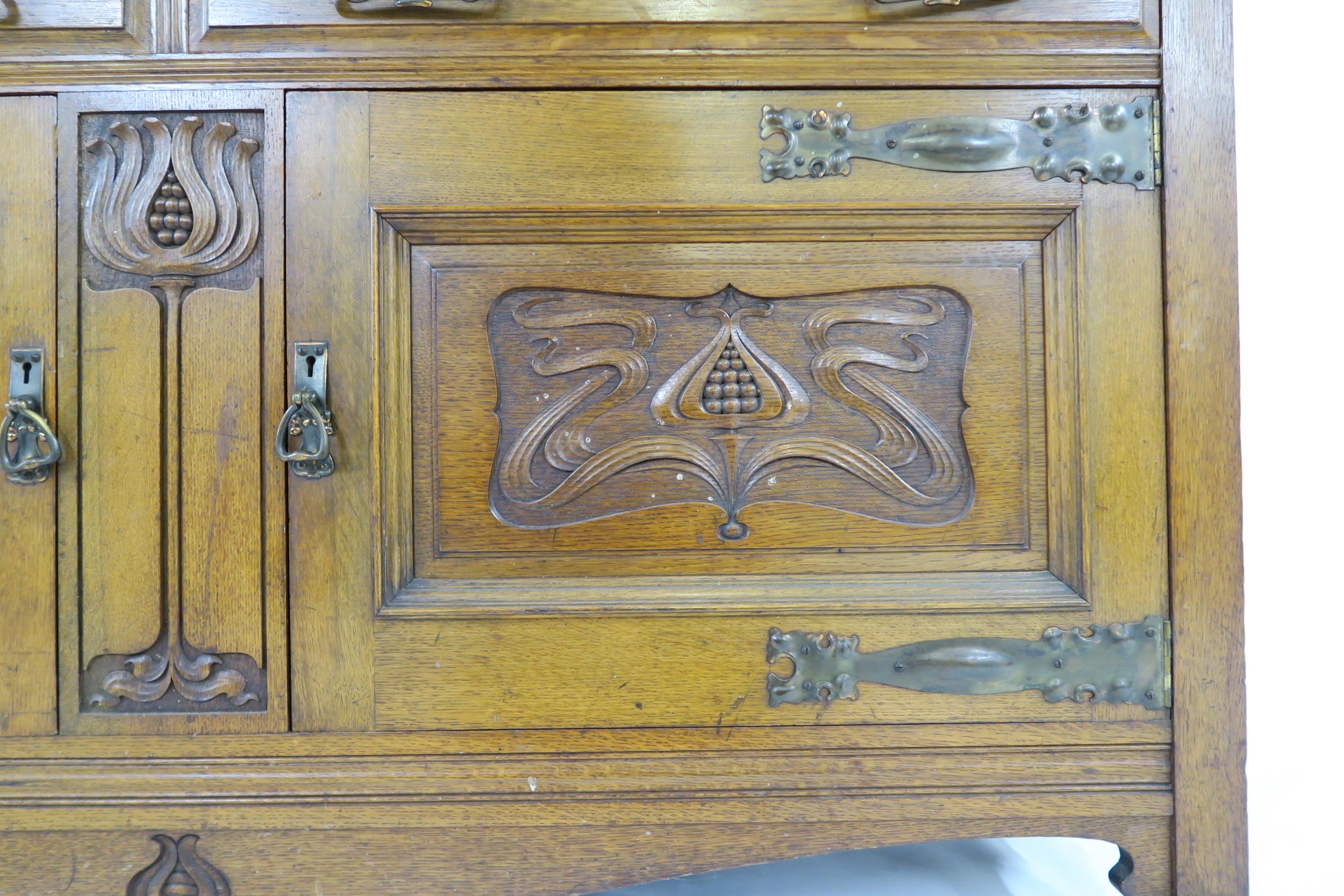 A LATE VICTORIAN OAK ARTS & CRAFTS BOOKCASE with moulded cornice over three glazed doors over two - Image 4 of 9