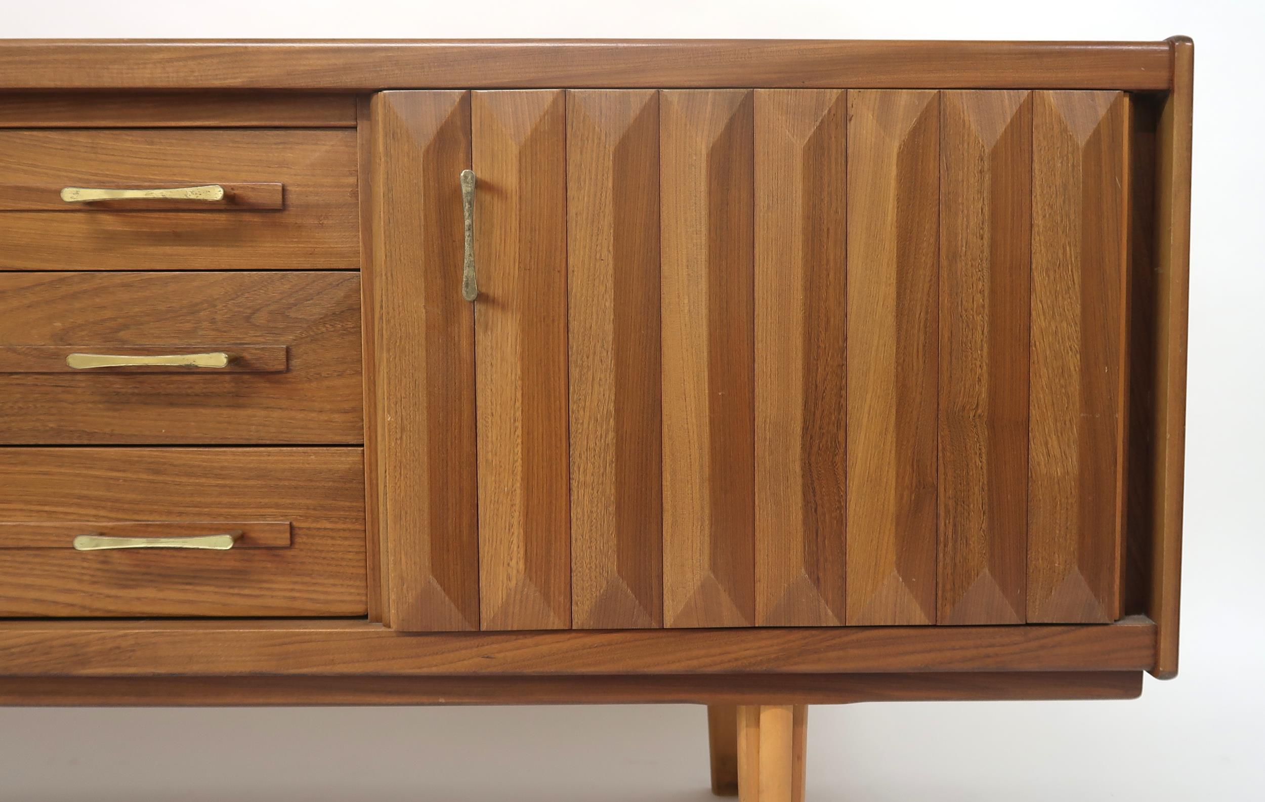 A MID 20TH CENTURY TEAK SIDEBOARD with three long central drawers flanked by cabinet doors with - Image 2 of 12