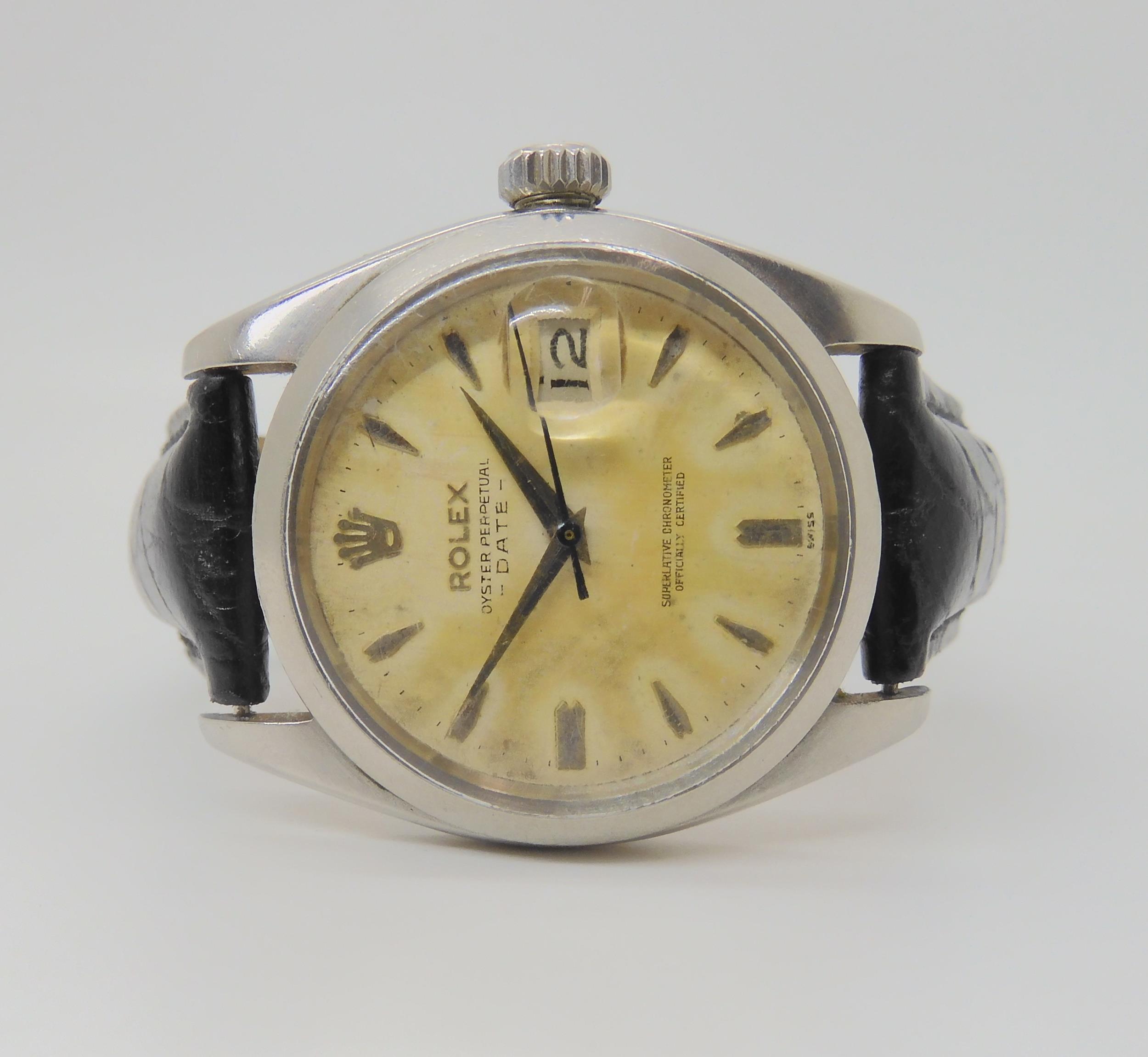 A ROLEX OYSTER PERPETUAL DATE with cream patinaed dial, dagger indexes and date aperture. Diameter