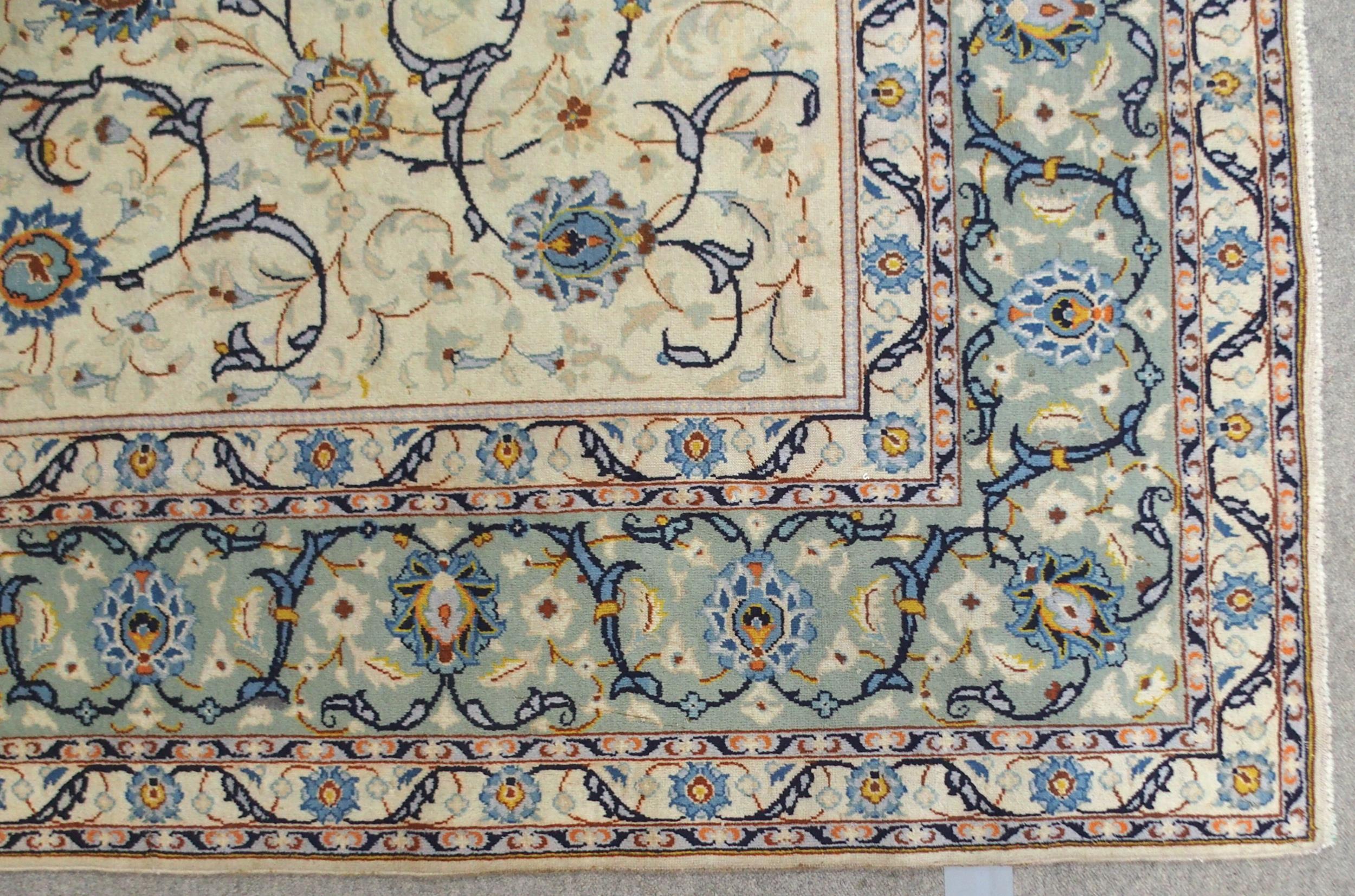 A CREAM GROUND KASHAN RUG with all-over floral design and flower head border, 361cm long x 242cm - Image 3 of 8