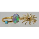 AN OPAL RING AND OTHER ITEMS The solid black opal has lively green, purple and blue colour play, and