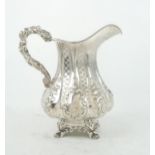 AN EARLY VICTORIAN SILVER CREAM JUG by Samuel Hayne and Dudley Carter, London 1844, of lobed