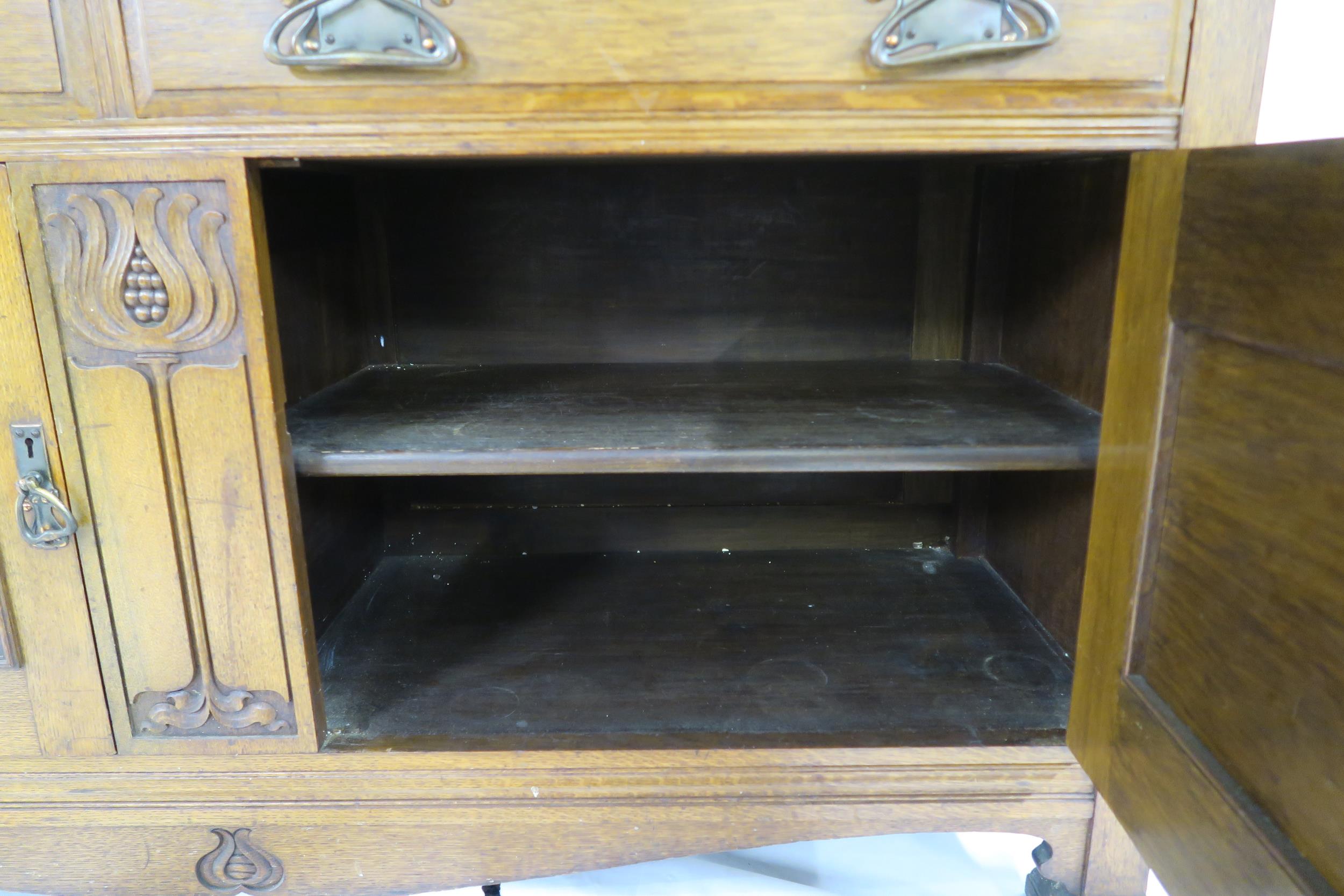 A LATE VICTORIAN OAK ARTS & CRAFTS BOOKCASE with moulded cornice over three glazed doors over two - Image 5 of 9