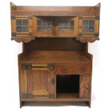 AN EARLY 20TH CENTURY OAK ARTS & CRAFTS SIDEBOARD BY WARINGS FOR WARING G GILLOW LTD  with leaded