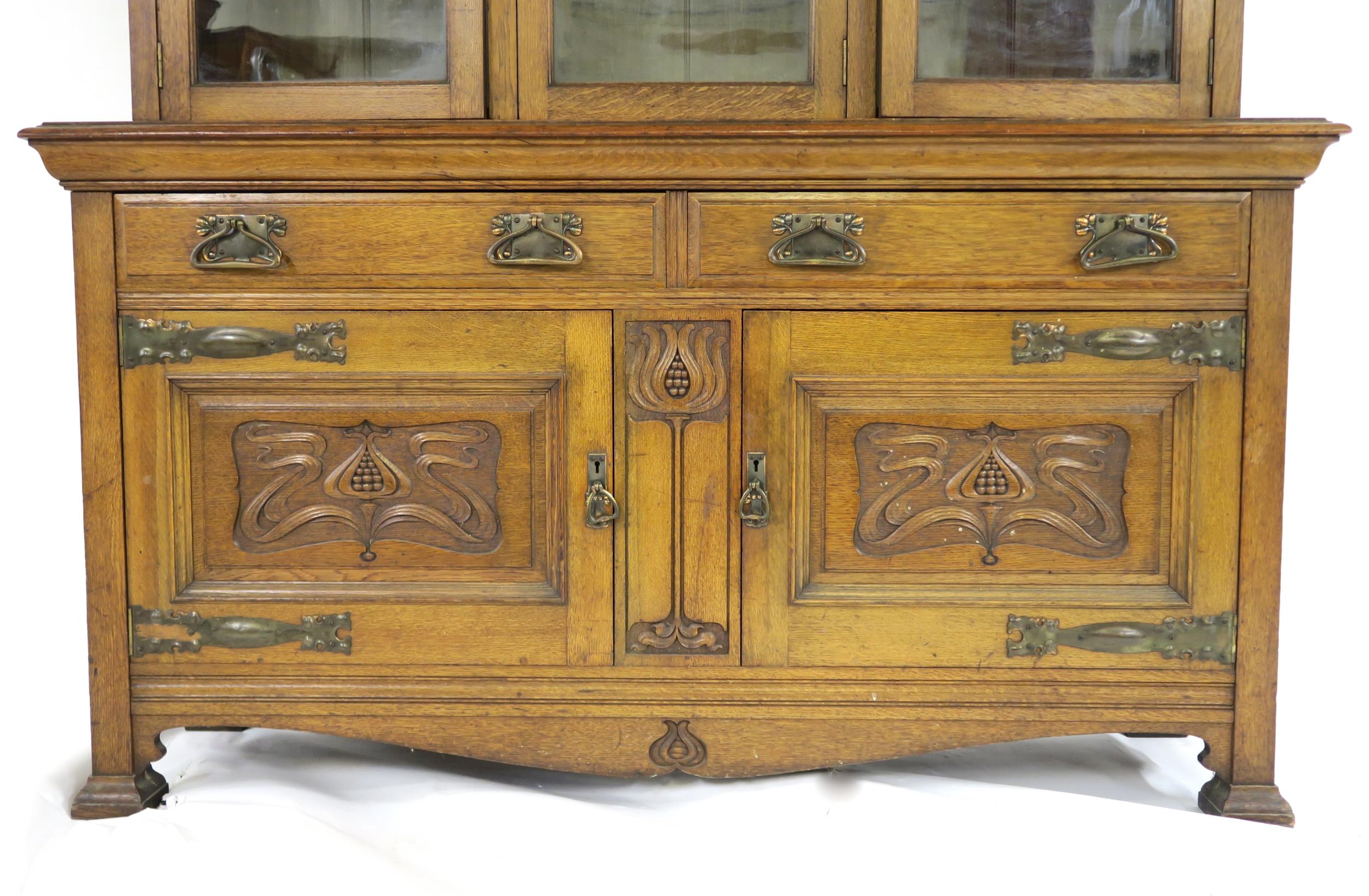 A LATE VICTORIAN OAK ARTS & CRAFTS BOOKCASE with moulded cornice over three glazed doors over two - Image 2 of 9