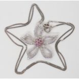 A DIAMOND SET FLOWER PENDANT set throughout in 18ct white gold, with a cluster of pink gemstones
