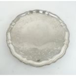 A GEORGE III SILVER SALVER London 1768, Maker's mark I.C, of lobed form, with a gadrooned border,