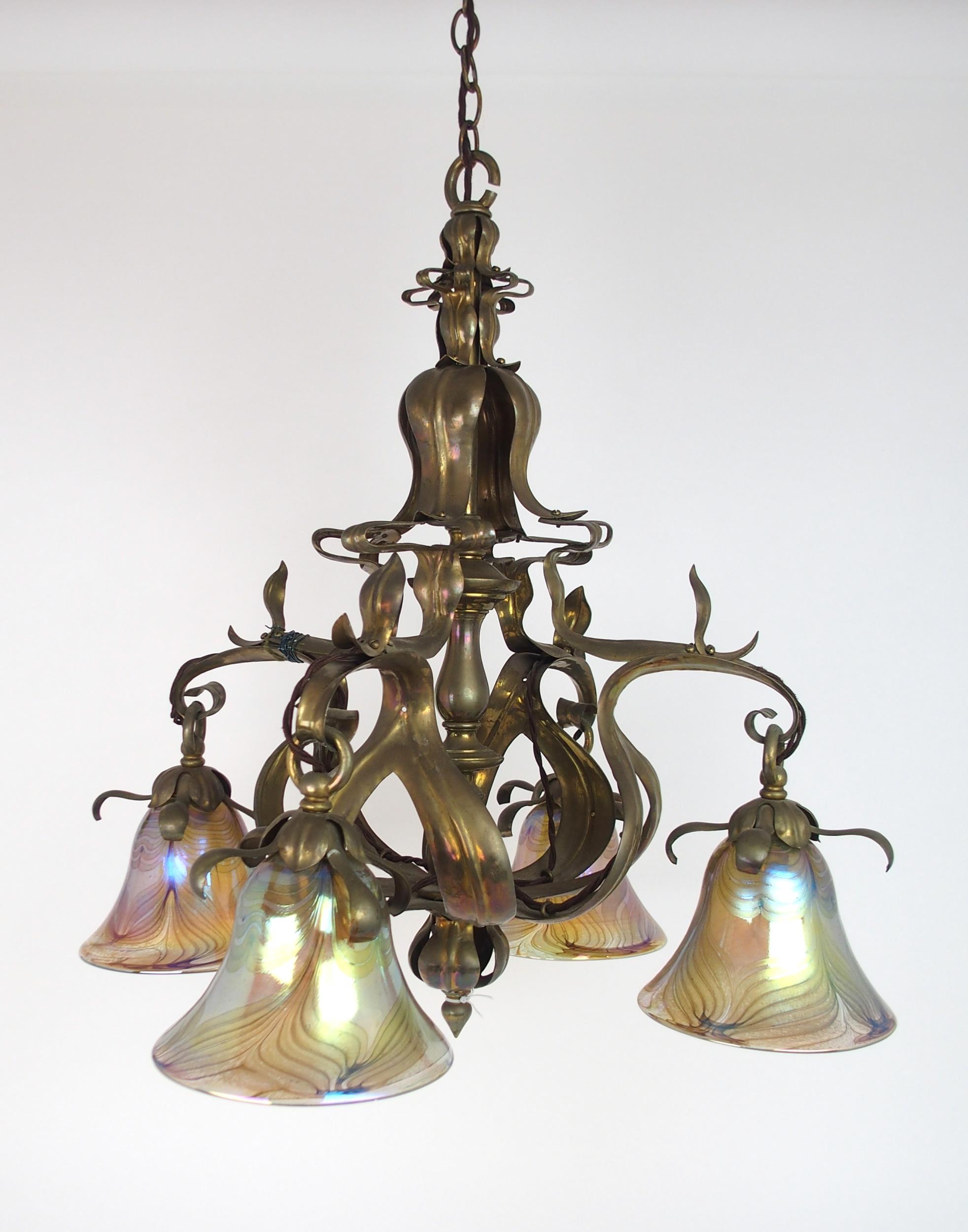 A BRASS ARTS AND CRAFTS HANGING LIGHT with later iridescent glass shades, 56.6cm x 59cm high, 104 cm