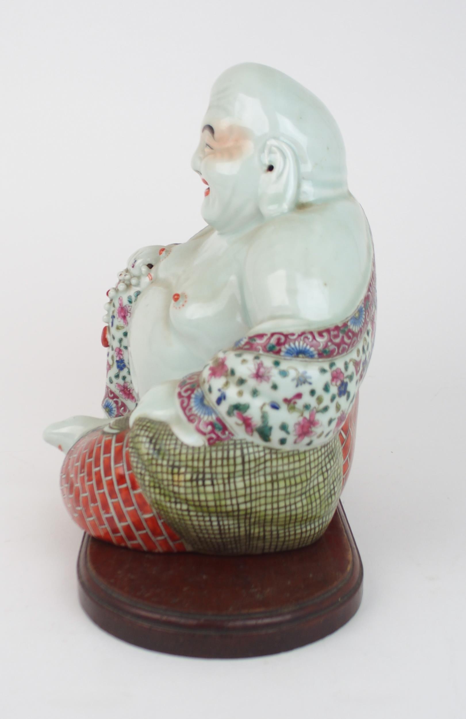 A CHINESE MODEL OF BUDDHA  seated with rosary beads and patterned costume, on a wooden stand, - Image 2 of 9