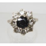 A SAPPHIRE AND DIAMOND CLUSTER RING set with estimated approx 1.60cts of brilliant cut diamonds,