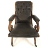 A VICTORIAN ROSEWOOD & GREEN BUTTON BACK LEATHER UPHOLSTERED LIBRARY CHAIR with reclined back over