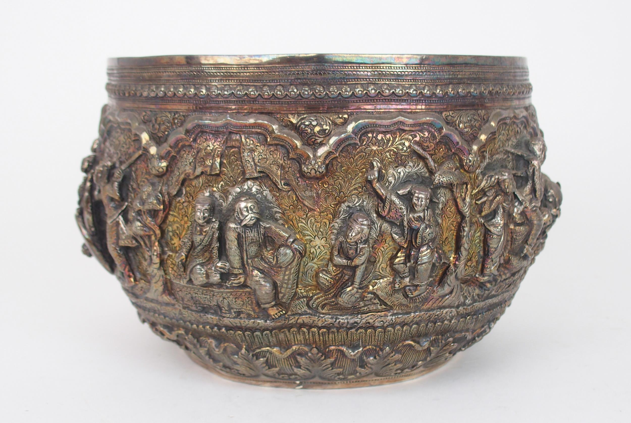 A BURMESE SILVER BOWL of rounded form, with profusely embossed and repousse work of villagers, - Image 2 of 13