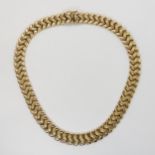 A 9CT ZIG ZAG PATTERN NECKLET with textured detail to the links, length 38.5cm, weight 46.1gms
