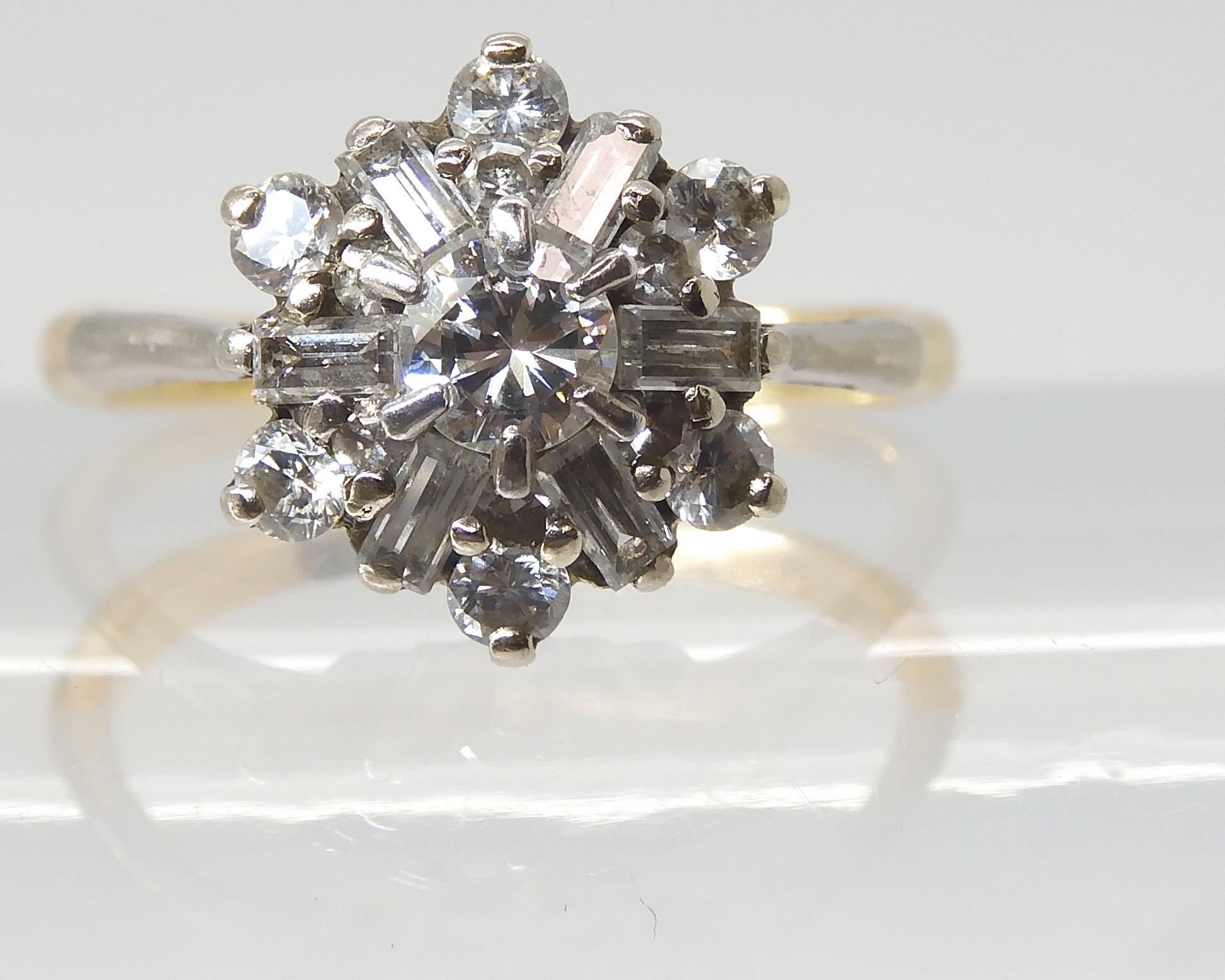 A DIAMOND CLUSTER RING set with estimated approx 0.68cts of brilliant and baguette cut diamonds, set