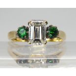 AN UNUSUAL DIAMOND AND DIOPSIDE RING mounted in 18ct yellow gold with full hallmarks for London