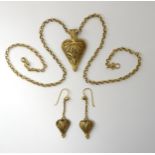 A FILIGREE HEART PENDANT & EARRINGS made in bright yellow metal with a handmade chain, length of the