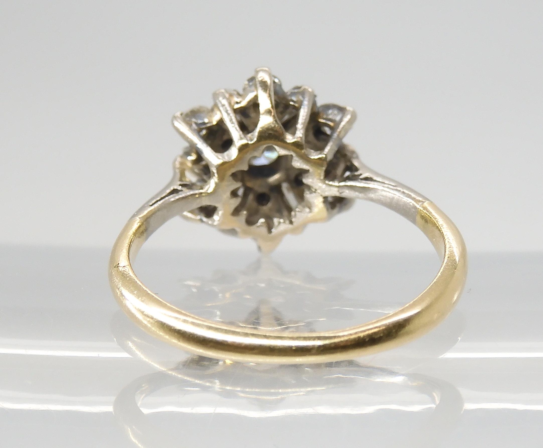 A DIAMOND CLUSTER RING set with estimated approx 0.68cts of brilliant and baguette cut diamonds, set - Image 5 of 5
