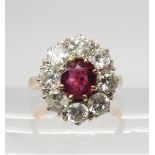 A SUBSTANTIAL RUBY & DIAMOND CLUSTER RING the central ruby measures 7.2mm x 6.4mm x 3mm and is