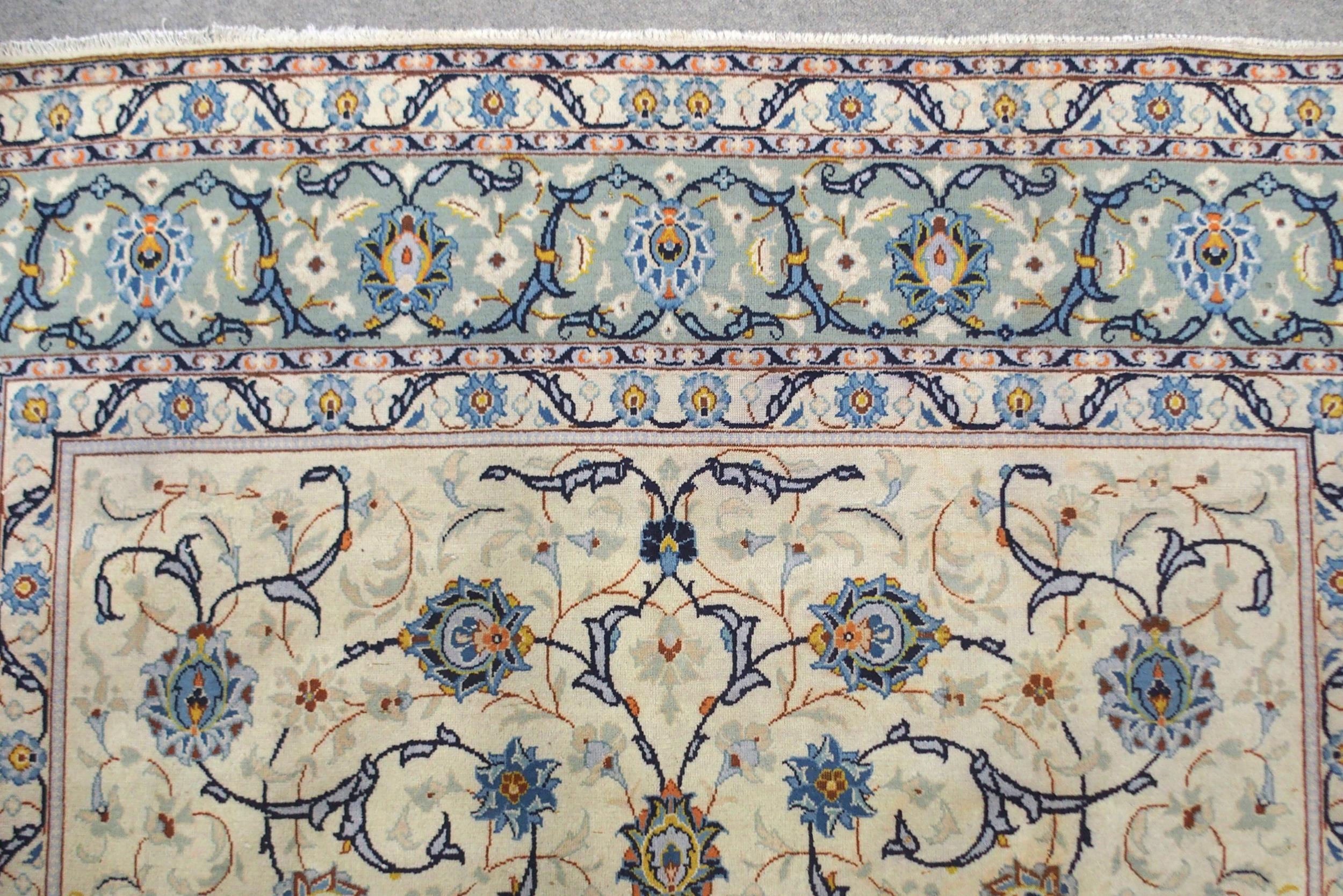 A CREAM GROUND KASHAN RUG with all-over floral design and flower head border, 361cm long x 242cm - Image 4 of 8