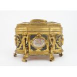 A MID 19TH CENTURY GRAND TOUR GILT METAL CASKET inset with shell cameos depicting pastoral scenes,