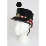 A LATE-VICTORIAN HIGHLAND LIGHT INFANTRY SHAKO The body of deep blue wool cloth, with chequered red,