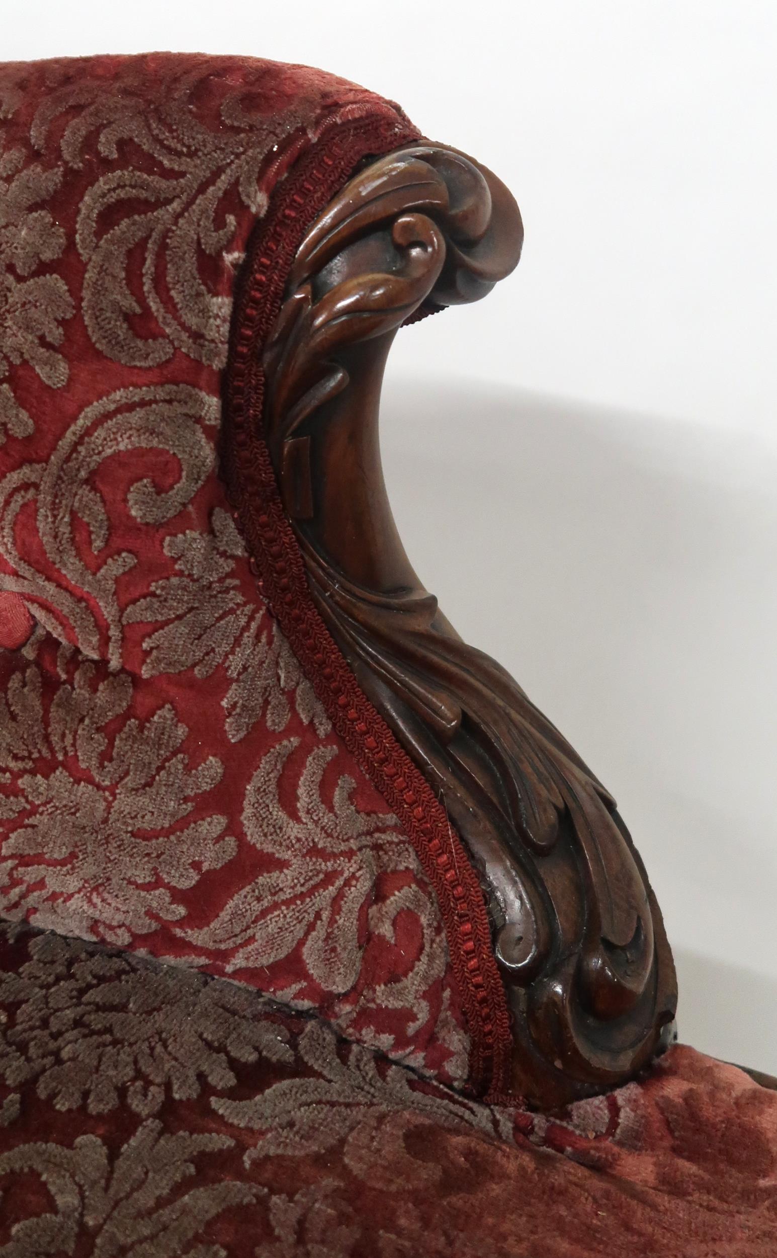 A VICTORIAN MAHOGANY FRAMED CHAISE LONGUE with foliate carvings, buttonback and seat upholstered - Image 5 of 8