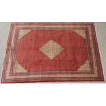 A RED GROUND ARAAK BOTTEH PATTERN RUG with cream central diamond medallion, matching spandrels and