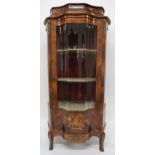 A CONTINENTAL ROSEWOOD SERPENTINE FRONT VITRINE with central serpentine door flanked by glazed