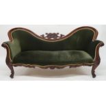 A VICTORIAN WALNUT FRAMED TWIN SPOONBACK SALON SETTEE with carved scrolled surmount over velour