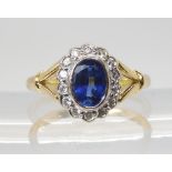 A SAPPHIRE & DIAMOND CLUSTER RING the central sapphire measures approx 7mm x 5mm x 3.4mm, further