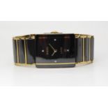 A RADO JUBILE with black diamond set oblong dial with date aperture and gold coloured hands, with